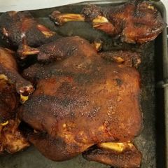 A picture of Smoked whole chicken and turkey legs.