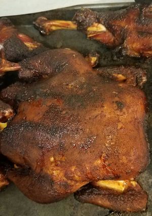 A picture of Smoked whole chicken and turkey legs.