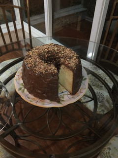 A picture of Butter pound cake with chocolate almond frosting.
