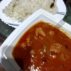 A picture of Chicken korma with rice.