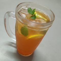 A picture of Orange flavored ice tea.