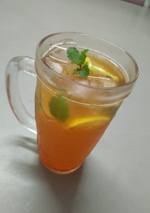 A picture of Orange flavored ice tea.