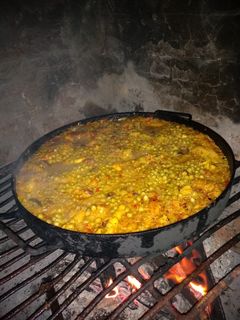 Una foto de Arroz con pollo al disco