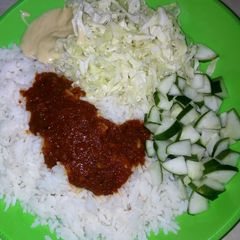 A picture of White rice wit cucumber & cabbbage.
