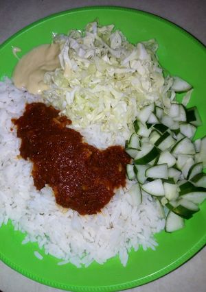 A picture of White rice wit cucumber & cabbbage.