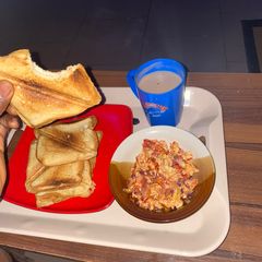 A picture of Toasted bread and fried egg breakfast.