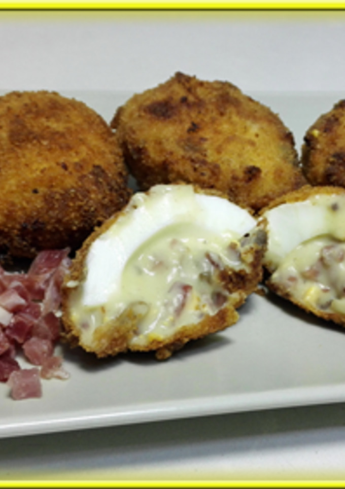 Una foto de Huevos rebozados, rellenos de jamón y Champiñones
