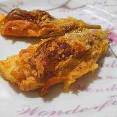 A picture of Fiori di zucca ripieni al forno.