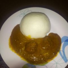 A picture of Pounded yam with dried okro/ogbono soup.