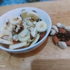 A picture of Banana with dry fruits.