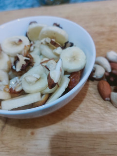 A picture of Banana with dry fruits.