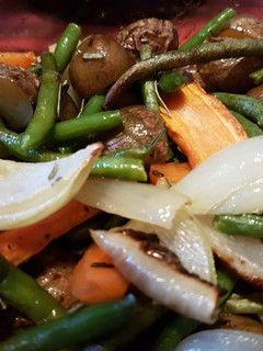 Una foto de Papas con Verduras al Horno