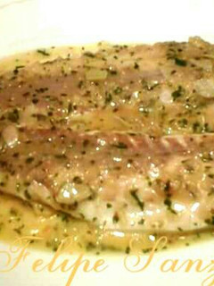 Una foto de Lubina en salsa