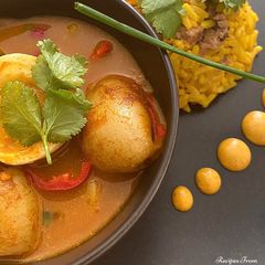 A picture of Egg & Potato Curry with Keema Rice.