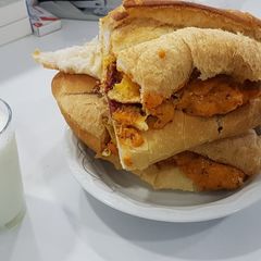 A picture of Work Place Omelette eggs, sausage, and cheddar cheese sandwich.