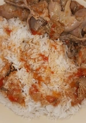 A picture of Yummy Matumbo Stew w/ rice or Ugali accompaniment.