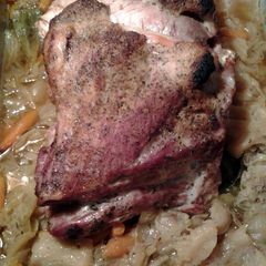 A picture of pork roast and cabbage.