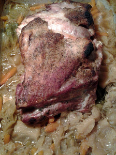 A picture of pork roast and cabbage.