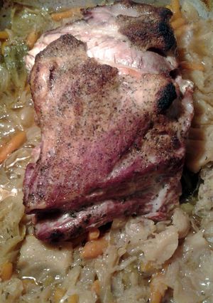 A picture of pork roast and cabbage.