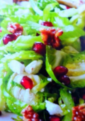 A picture of Shaved Brussels with Toasted Walnuts and Fresh Pomegranate..