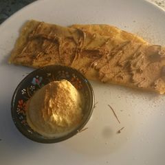 A picture of Cappuccino and hazelnut butter crepe 🍵.