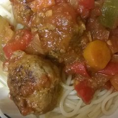 A picture of Meatballs with Tomato Vegetable Sauce.