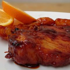 A picture of Pork Chop In Orange Sauce.