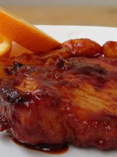 A picture of Pork Chop In Orange Sauce.