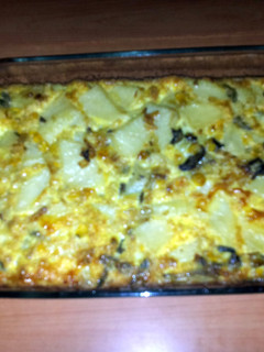 A picture of Eggs, potatoes and onions.
