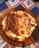 Polenta con tuco de costillas de cerdo