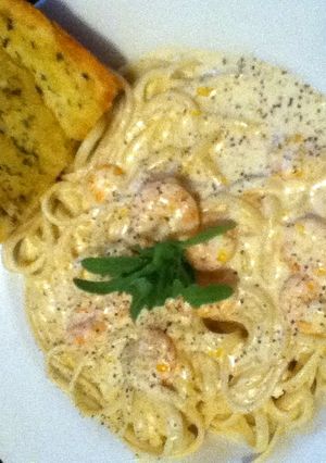 A picture of Shrimp in a Blue Cheese Sauce over Pasta.