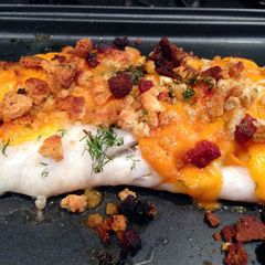 A picture of Baked cod with crispy chorizo and cheese topping.