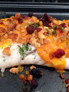 A picture of Baked cod with crispy chorizo and cheese topping.