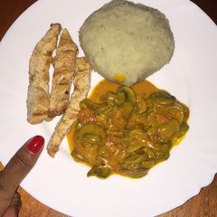 A picture of Pounded yam chicken and mushrooms.