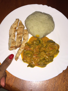 A picture of Pounded yam chicken and mushrooms.