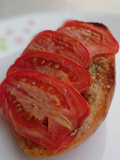 A picture of Bread And Butter With Hazelnut Top Tomato.