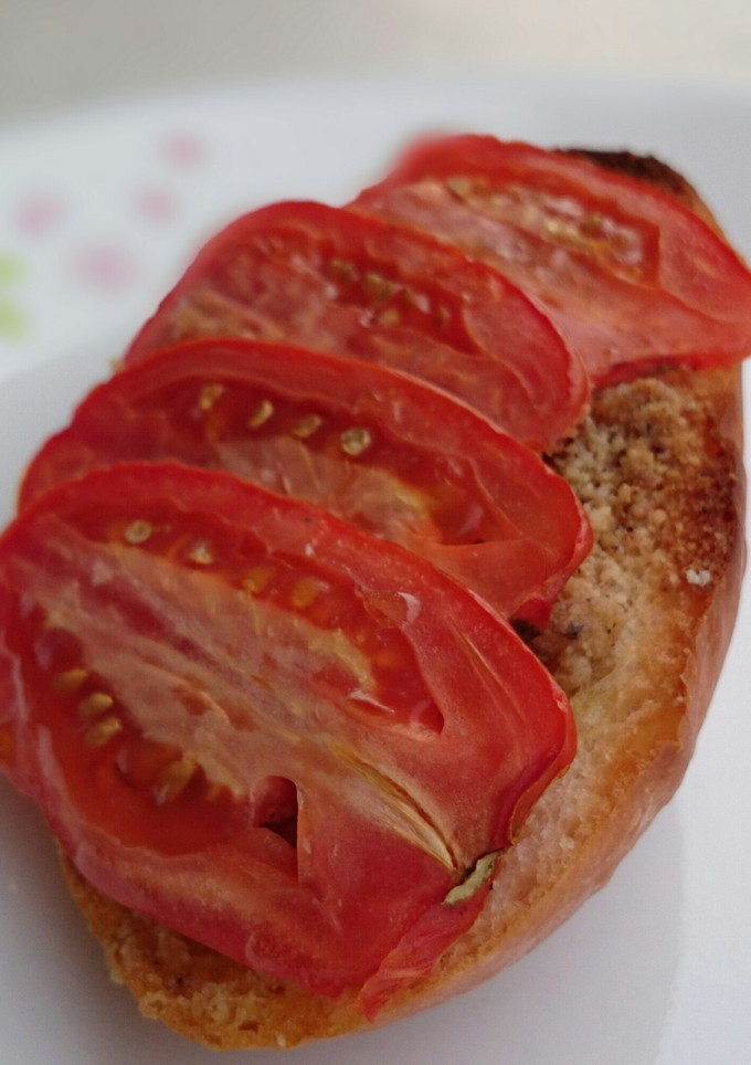 A picture of Bread And Butter With Hazelnut Top Tomato.