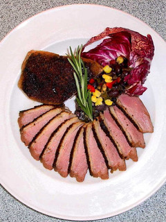 A picture of Duck Breasts with Concord Sauce.