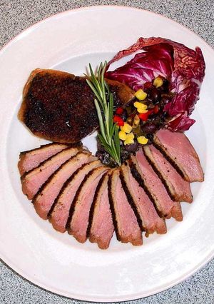 A picture of Duck Breasts with Concord Sauce.