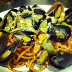 A picture of Italian style Mussels and Pasta.