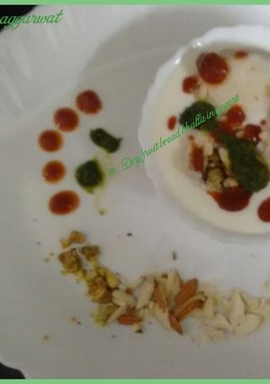 A picture of Dryfruit bread bhalla in yogurt.