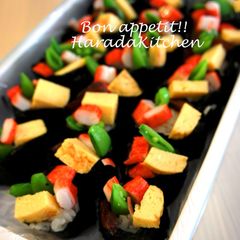 A picture of Snap Pea, Egg & Crab Stick Battleship Sushi Rolls.