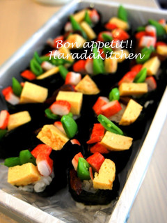 A picture of Snap Pea, Egg & Crab Stick Battleship Sushi Rolls.