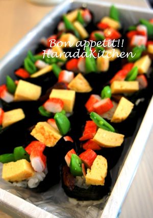A picture of Snap Pea, Egg & Crab Stick Battleship Sushi Rolls.