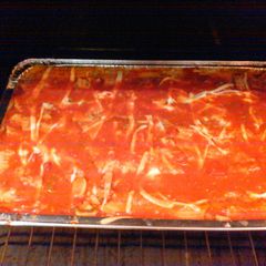 A picture of Chicken , spinach stuffed manicotti.
