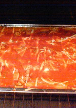 A picture of Chicken , spinach stuffed manicotti.