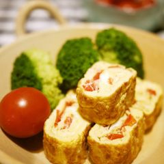 A picture of Soup Stock Flavored Omelette with Cherry Tomatoes.