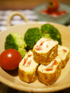 A picture of Soup Stock Flavored Omelette with Cherry Tomatoes.