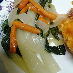 A picture of Bok choy, onion and carrots.