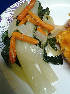 A picture of Bok choy, onion and carrots.